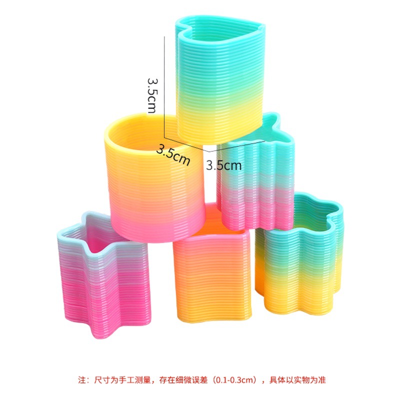 Qixing Rainbow Ring transfronterizo exclusivo para la escuela en forma de supermercado Premio templo justo juguete anillo de primavera suministro directo de fábrica