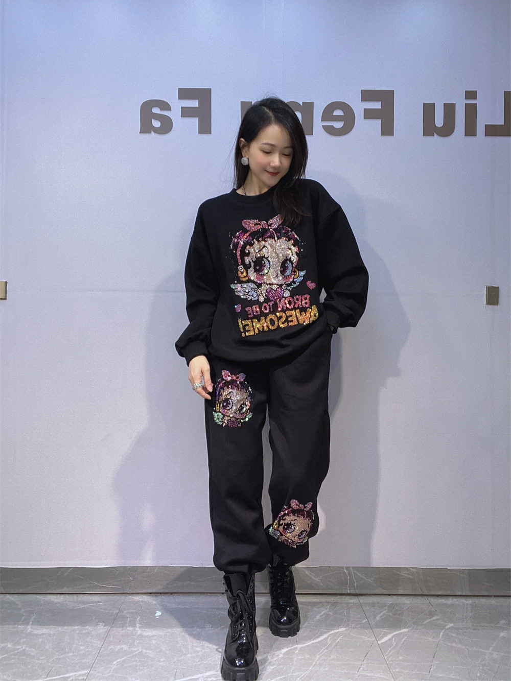 Europa y América ropa de mujer estilo coreano de diamante caliente cuello redondo manga larga suéter de vestir para mujeres de otoño y invierno pantalones sueltos de dos piezas de ropa deportiva