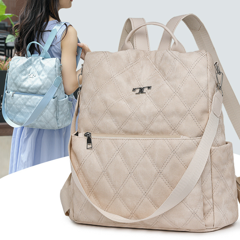 Nueva mochila de cuero suave antirrobo para mujer de gran capacidad y moda Lingge al aire libre mochila de doble uso para viajes ligeros al por mayor