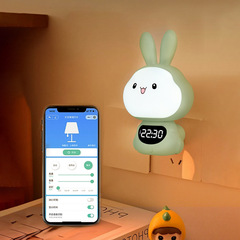 工場商品の新型ウサギの小夜灯の音声制御は電気時計の回転角度の雰囲気のベッドの頭の小さいプログラムの明かりを挿します。