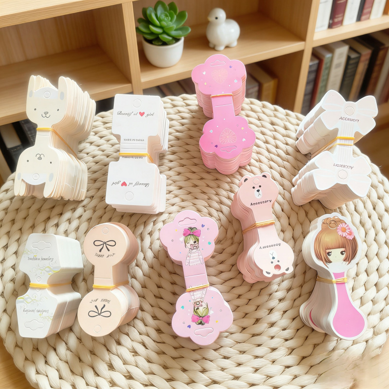 Tarjeta de embalaje de tarjeta plegable especial creativa tarjeta de cuerda de cabello infantil tarjeta de papel de anillo de intestino grueso tarjeta de cabeza de cuerda de papel joyas tarjeta de visualización
