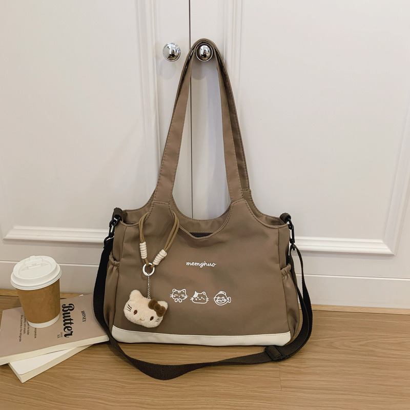 2026 nuevo lindo bolso de tote nicho de moda simple textura de viaje universal mujer gran capacidad mochila de hombro