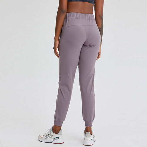 Spring and summer new style elastic waisted yoga pants, simple straight sports and casual elastic leg-tie nine-point pants for women