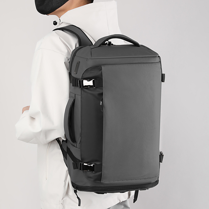 Bolso abierto transfronterizo mochila simple al aire libre transpirable reducción de carga doble hombro bolso de hombre de gran capacidad almacén de zapatos independiente USB