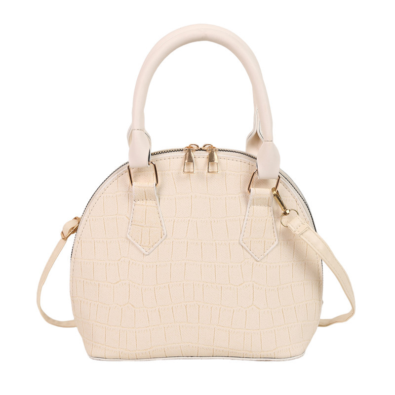 Bolso de mano de piedra para mujeres 2024 nuevo bolso de concha de textura bolso de hombro de moda minimalista estilo elegante mochila
