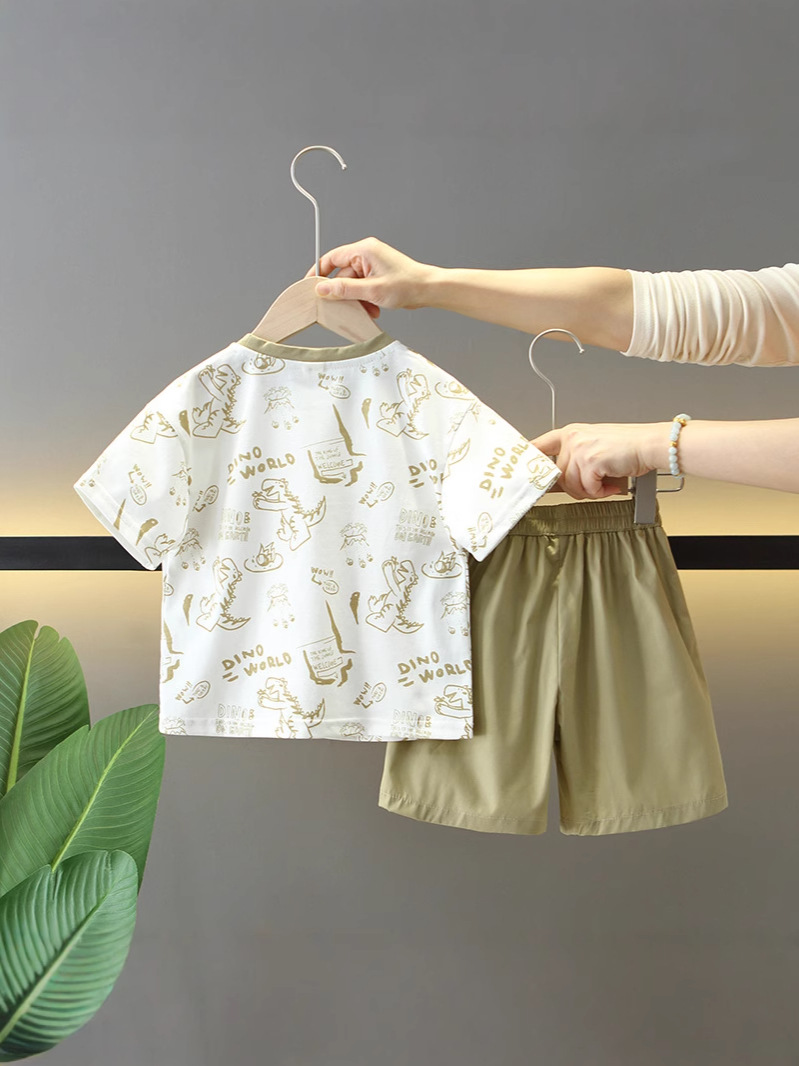 7277 Traje de verano para niños 2025 nuevo estilo estilo occidental dibujos animados para niños dinosaurio de manga corta bebé verano delgado dos piezas