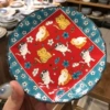 6.25-inch flower-shaped dish—nine cats