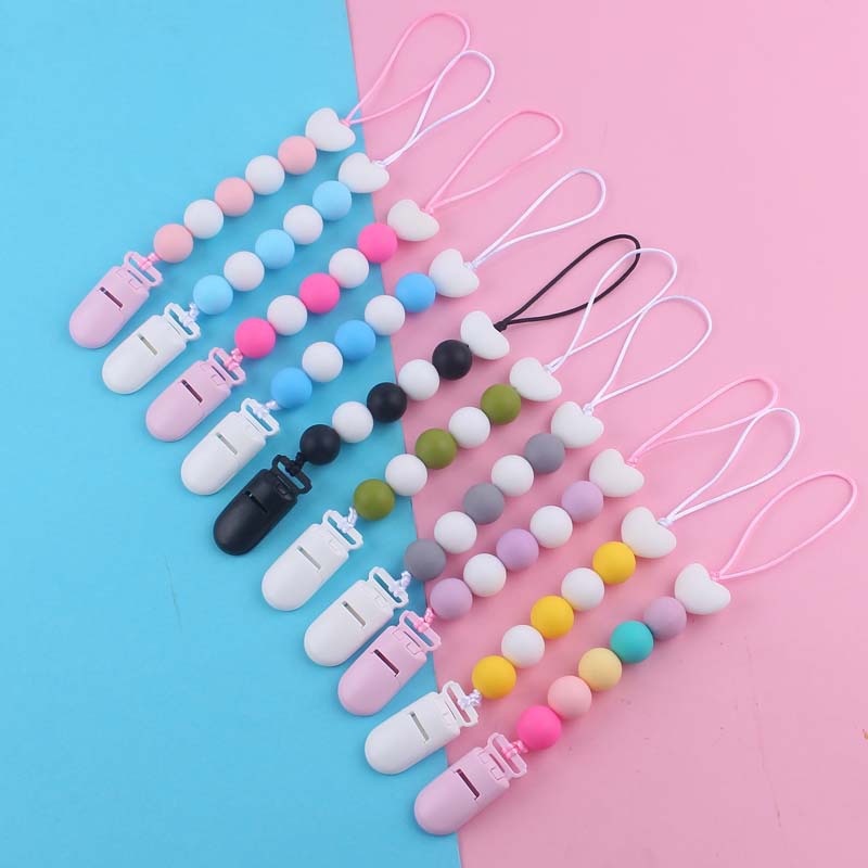 Nuevo bebé suministros de dibujos animados amor silicona DIY creativo macaron color serie mordedura cola molar pezón