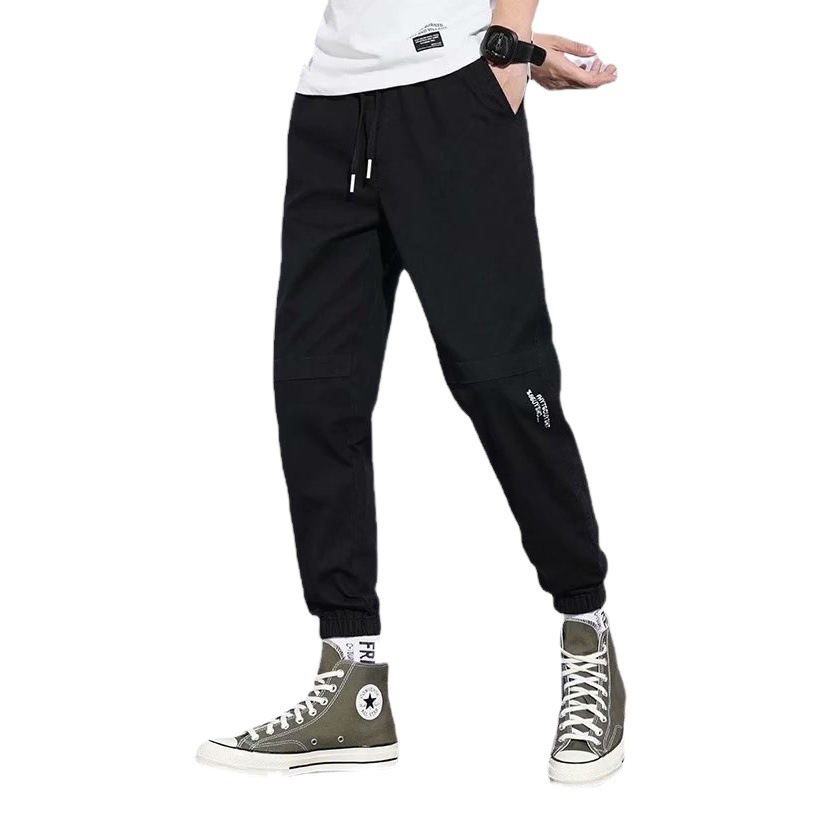 Pantalones de estilo de Hong Kong pantalones casuales de los hombres de estilo japonés de color sólido sueltos monos atados a los tobillos pantalones casuales de los hombres de la marca de moda Pantalones a juego