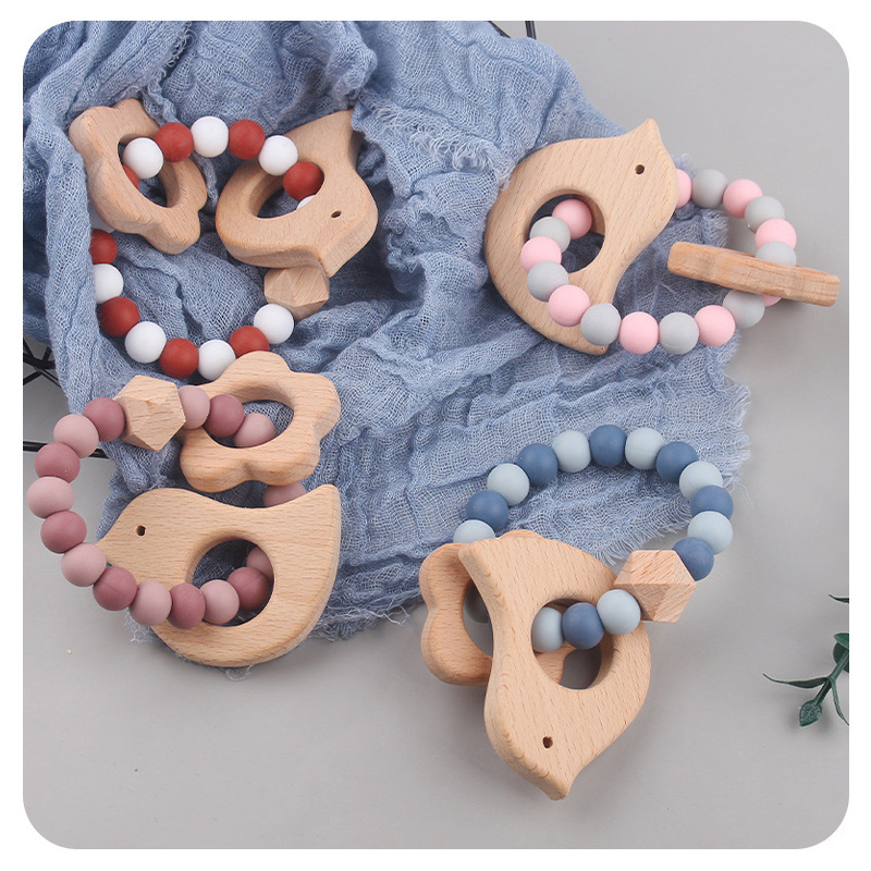 Nuevo bebé dibujos animados pájaros pulsera de madera de haya juguetes creativos pulsera de dientes de silicona pulsera de dientes
