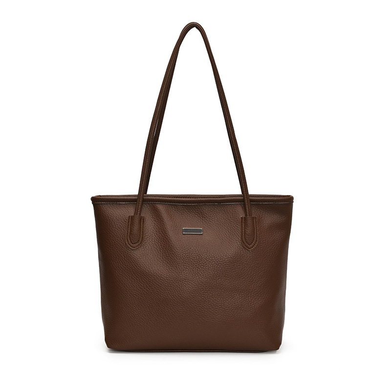 Nuevo bolso de gran capacidad de primavera en 2025 Bolso de hombro de color sólido casual popular de este año Bolso de mujer Tote de axila de estilo occidental