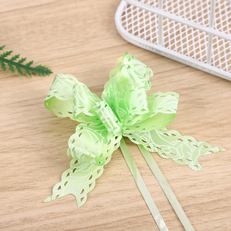 Comercio exterior Venta caliente 18 impreso encaje arco mano-Tirado flor Navidad vacaciones regalo embalaje tirar flor multicolor multi-patrón