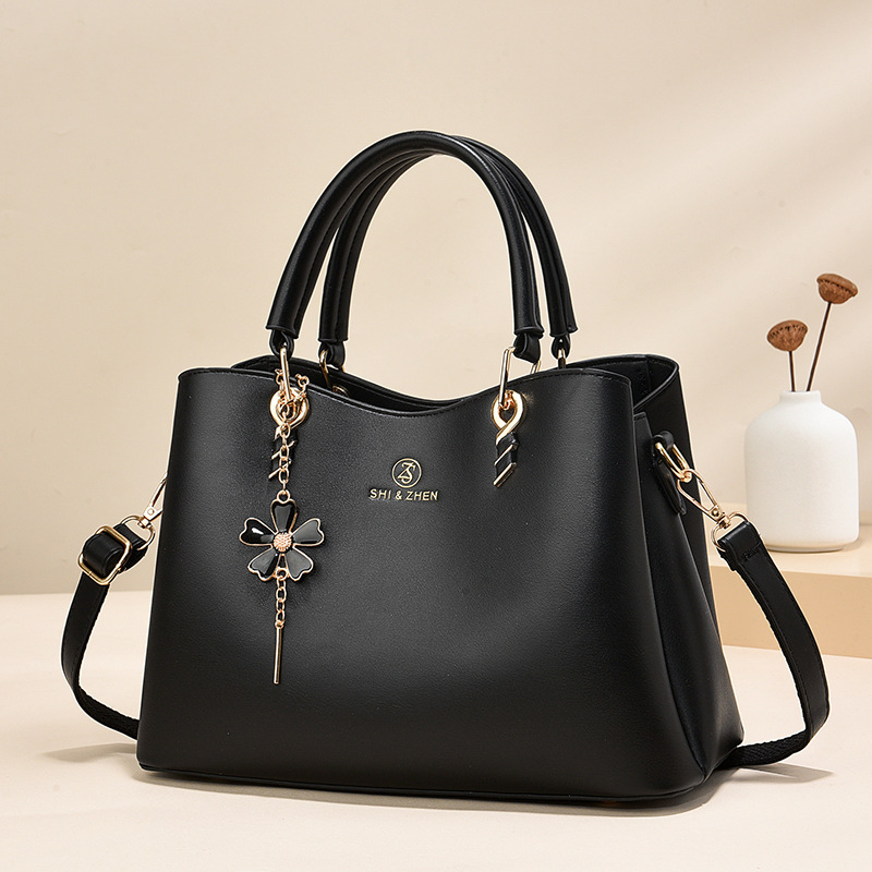 Colgante de flores bolsas de mano de color sólido de gran capacidad de moda versátil bolsas de hombro ocio de viaje oblicuo bolsas transfronterizas