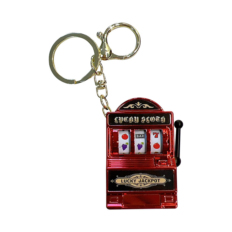 Juego divertido de color brillante de frutas shaker keychain máquina de juego garra de llaves colgante pequeño regalo al por mayor