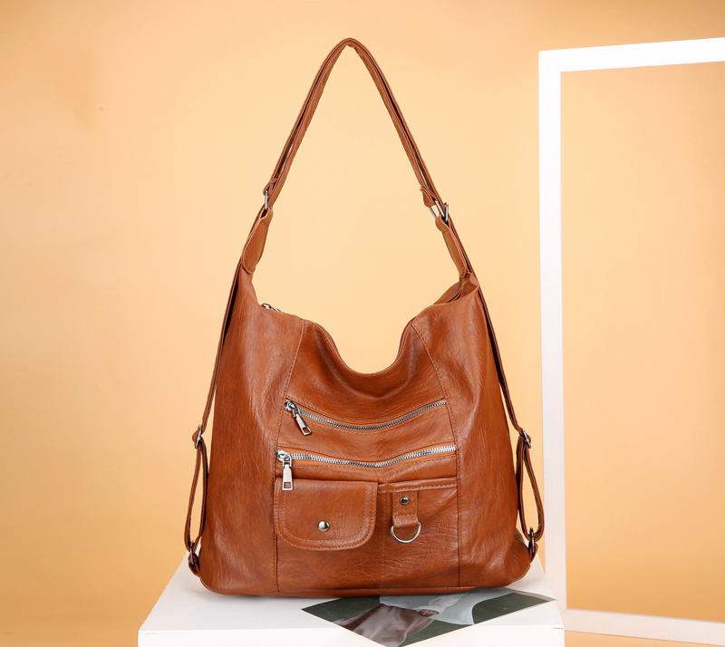 Transfronterizo nuevo bolso de las mujeres de la PU de la moda europea y americana mochila retro de las mujeres simple casual multi-funcional de las mujeres