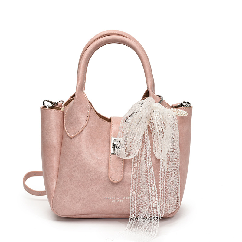 Coreano ultra caliente nicho bolso de cubo portátil para mujeres 2025 nuevo estilo de moda textura versátil alta sensación de hombro mochila