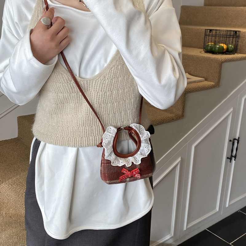 Dolce encaje de niña bolso de hombro, bolso de mini bebé, bolso de otoño y invierno, nuevo tipo de bolso para niños