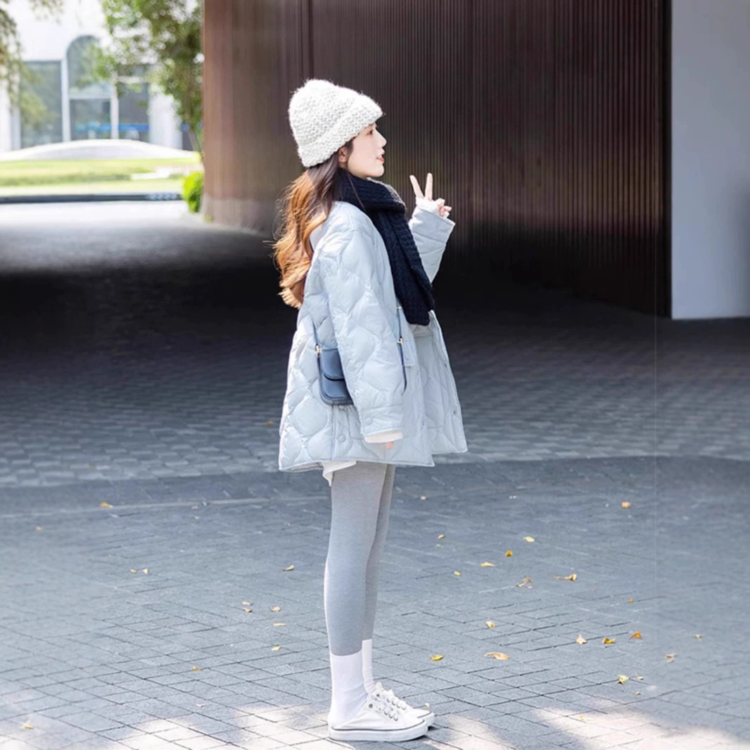 Blue down jacket with diamond pattern with a round collar, Chanel style