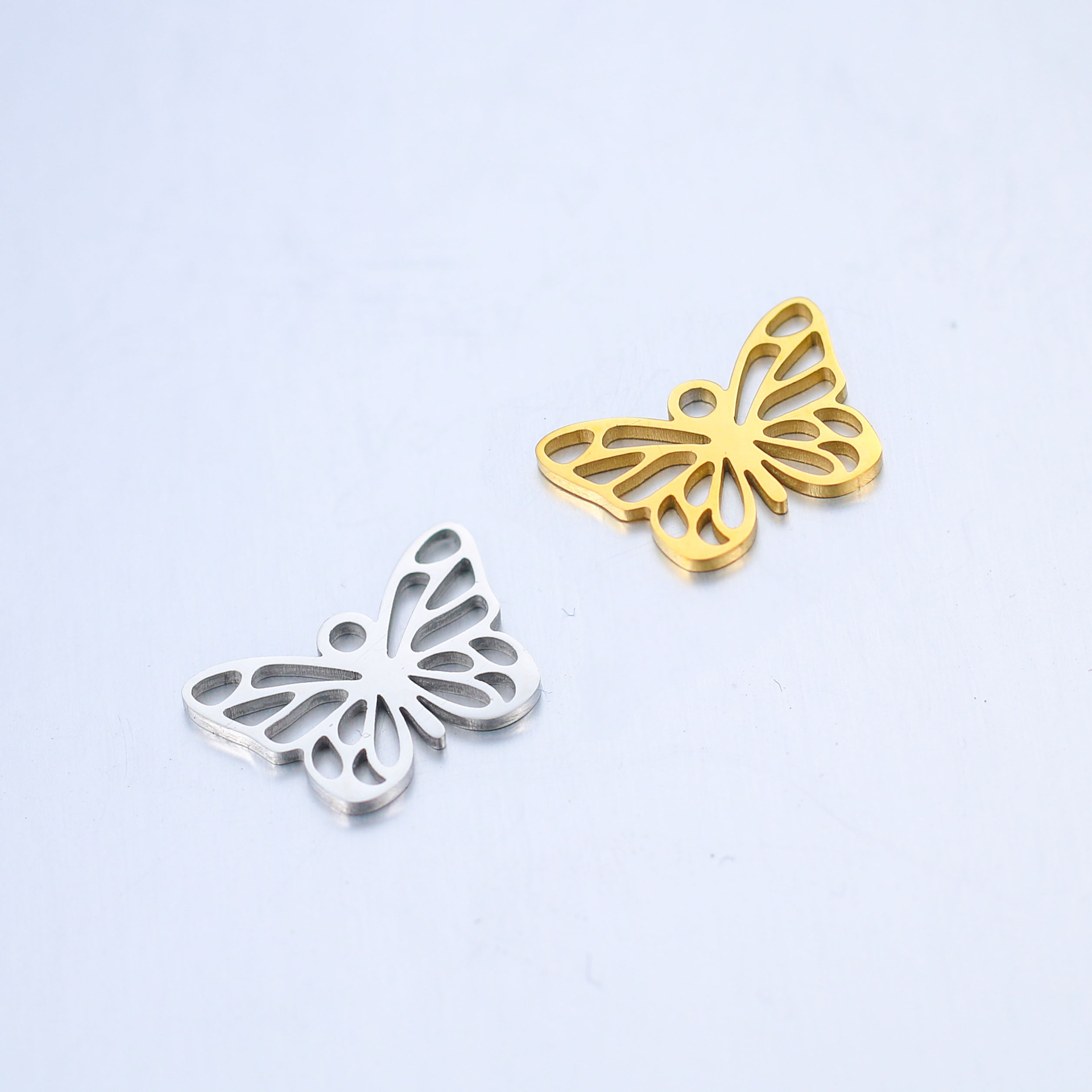 Breloques bronze papillon : bijoux DIY élégants