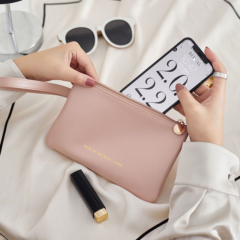 Bolsa de teléfono móvil para mujeres 2023 nuevo cuero ligero portátil de alto grado Mini bolsa de cosméticos de almacenamiento pequeño impermeable