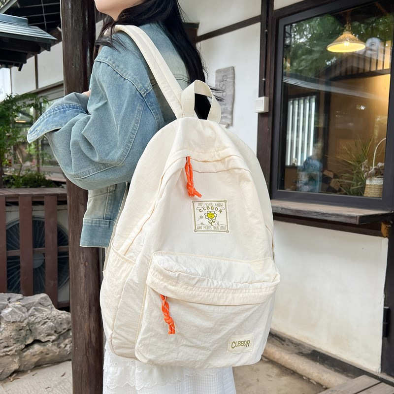 2024 otoño nuevo estilo ins versión coreana de la mochila de la escuela secundaria de gran capacidad estilo japonés contraste color sólido mochila doble al por mayor