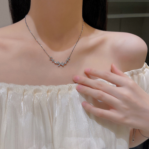 Korean micro-encrusted diamond bow titanium steel necklace women's ins trend light luxury niche pull-out bracelet two-piece set