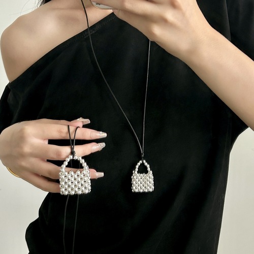 A handmade copper bead necklace with a vintage and unique design, featuring a long pendant shape inspired by Korean blogger accessories.