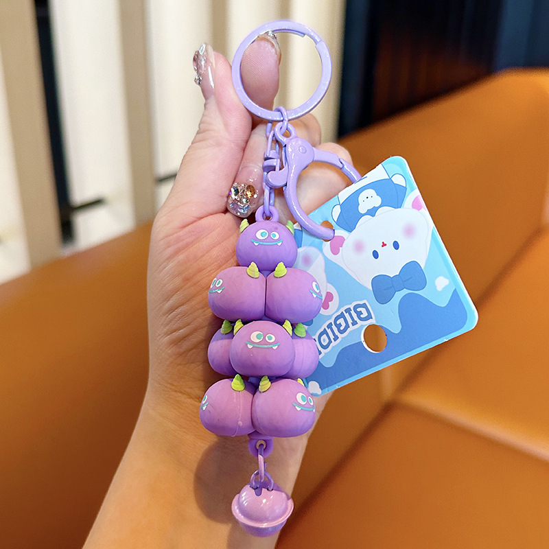 Popular en línea rojo creativo monstruo de dibujos animados jengle lindo mochila colgante coche llavero pareja pequeño regalo