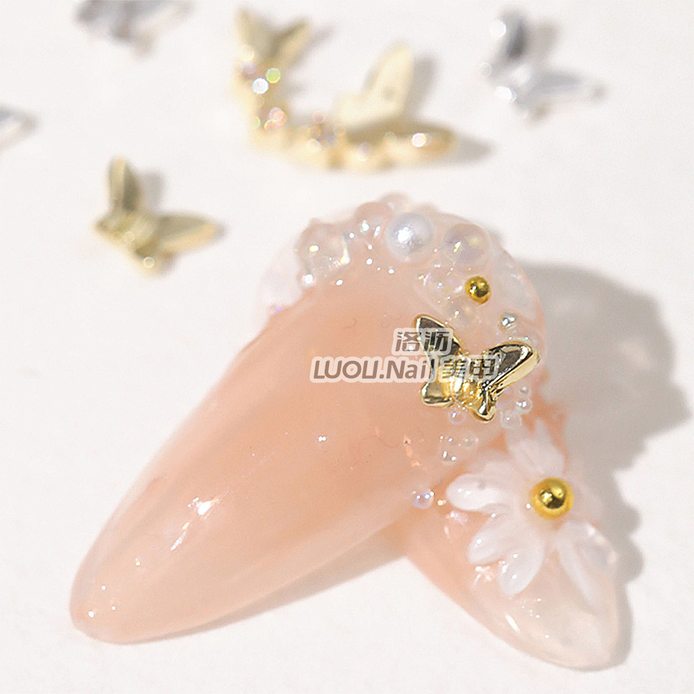 Nueva mariposa japonesa joyería de uñas en línea celebridad aleación tridimensional mariposa de una pieza mini mariposa hueca decoración de uñas