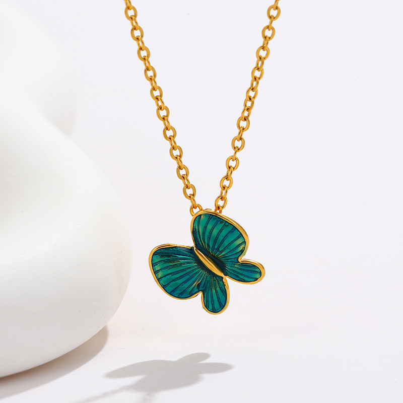 Joyería de xupe colorido esmalte gota aceite mariposa colgante temperamento femenino Corea del Sur simple nicho colgante de verano joyería