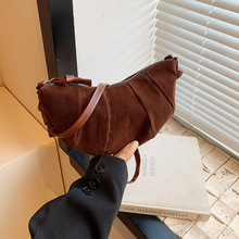 秋冬高级感复古拼接磨砂小包包女式2024新款牛角包百搭斜挎饺子包