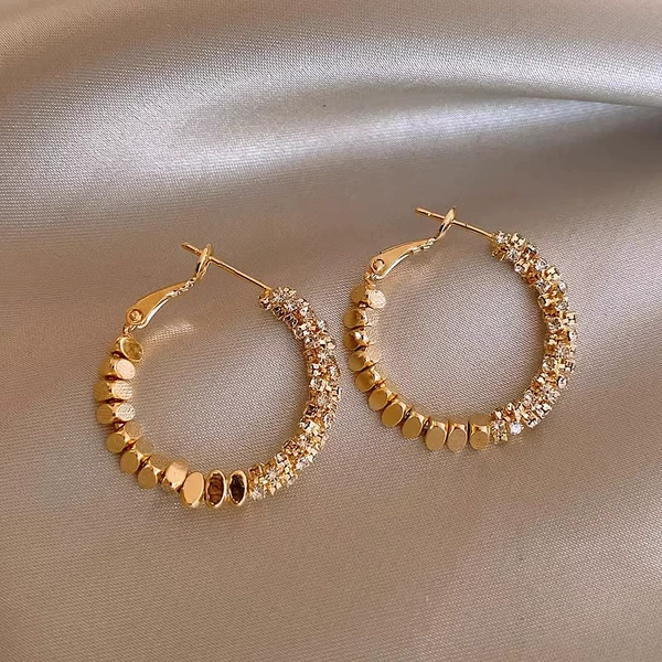 Golden earrings, bright catchy style