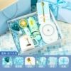 Blue automatic ceramic air fan, spoon, postcard with butterfly, flashing light