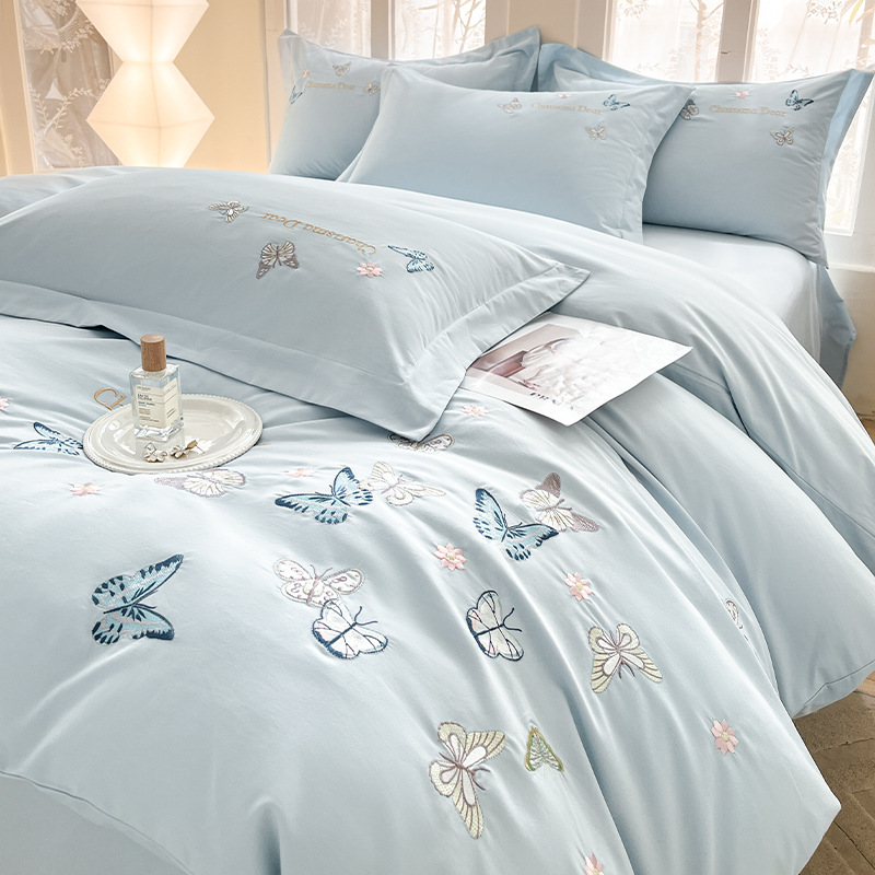 Cama de cuatro piezas de algodón puro algodón 2025 nuevo estilo ligero de lujo bordado funda edredón sábana ropa de cama de alta calidad traje de cuatro piezas ligero