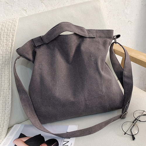 Letter solid color printed canvas large bag style trendy men's canvas shoulder crossbody bag large capacity tote bag can be shipped on behalf of