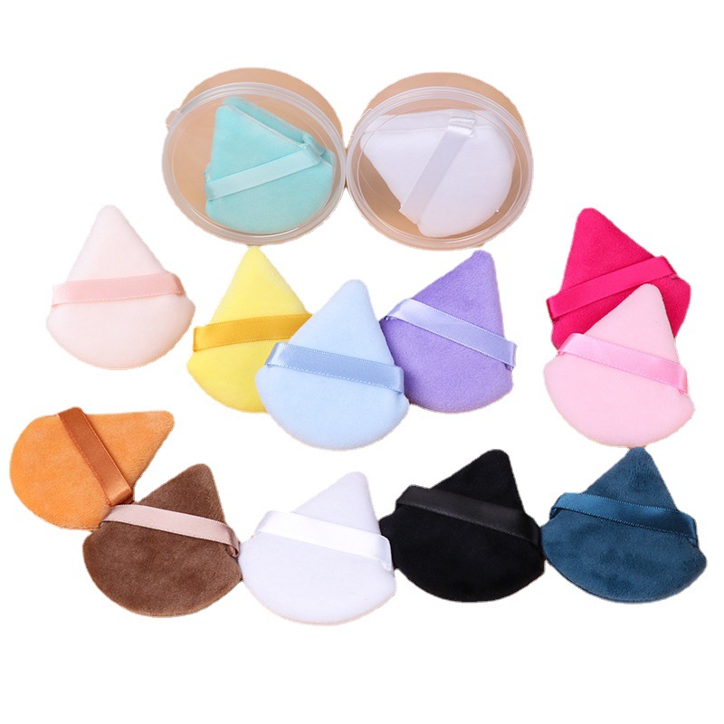 Mini-transfronterizas pequeño triángulo soplo maquillaje suelto soplo de maquillaje esponja polvo polvo cojín de aire de dedo al por mayor soplo de flocado