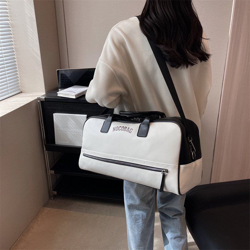 Bolsa de equipaje de gran capacidad de viaje de negocios de corta distancia Nueva bolsa de viaje de color de contraste de moda bolsa de almacenamiento de ropa portátil simple de un hombro