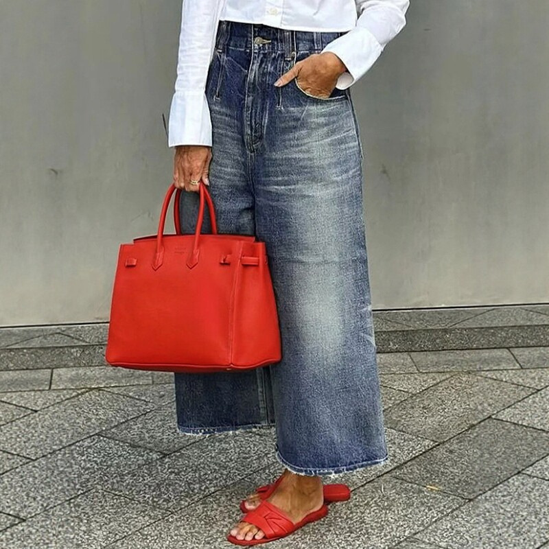 Loose wide-leg jeans with buckles, tassels, and pockets