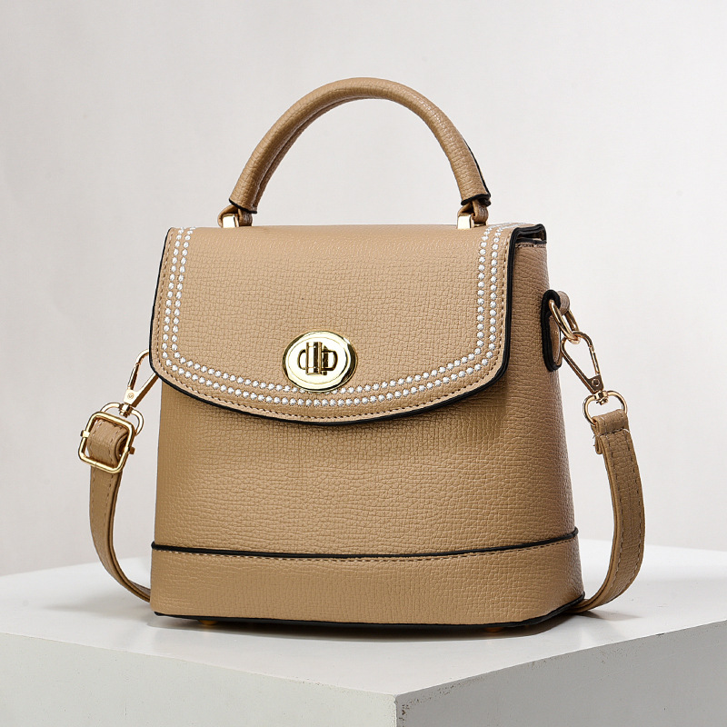 Bolso de mujer nuevo nicho de diseño texturizado bolso de hombro de moda moda bolso de mano práctica mochila bolsas