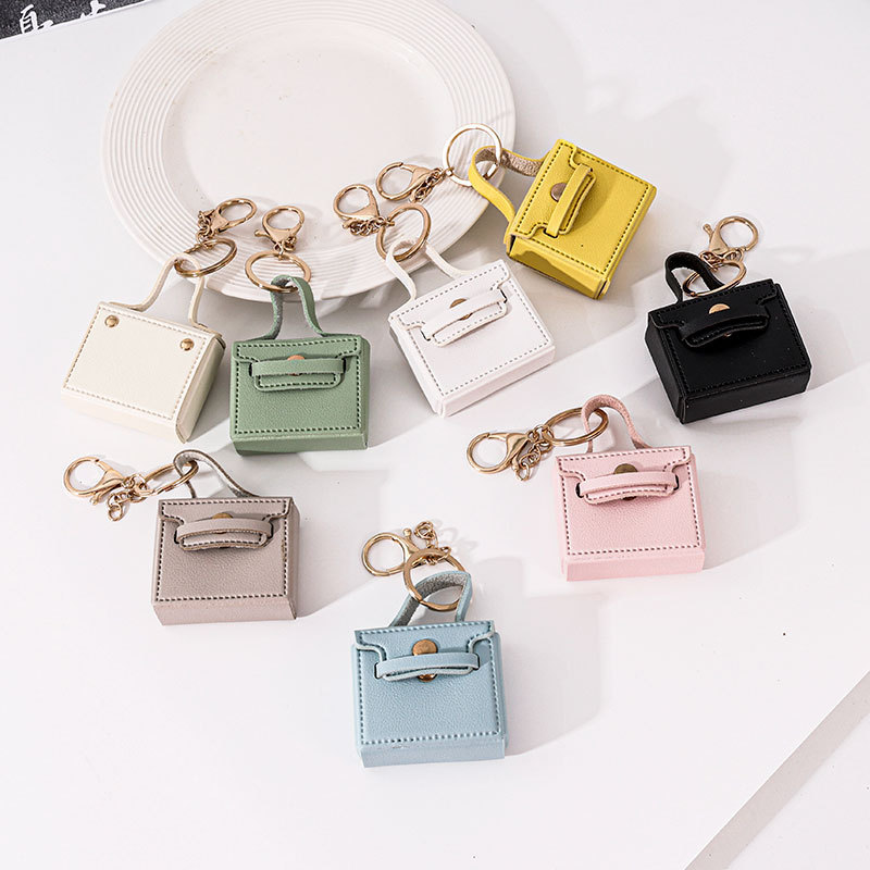 Cross-border solid color small square bag creative gift mouth red envelope key chain earphone bag car pu key chain pendant wholesale