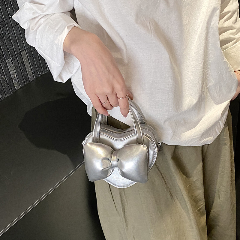 Mini lindos bolsos de mano en forma de corazón de melocotón, bolsos de hombro para bebés de color sólido, nuevos bolsos para niños transfronterizos