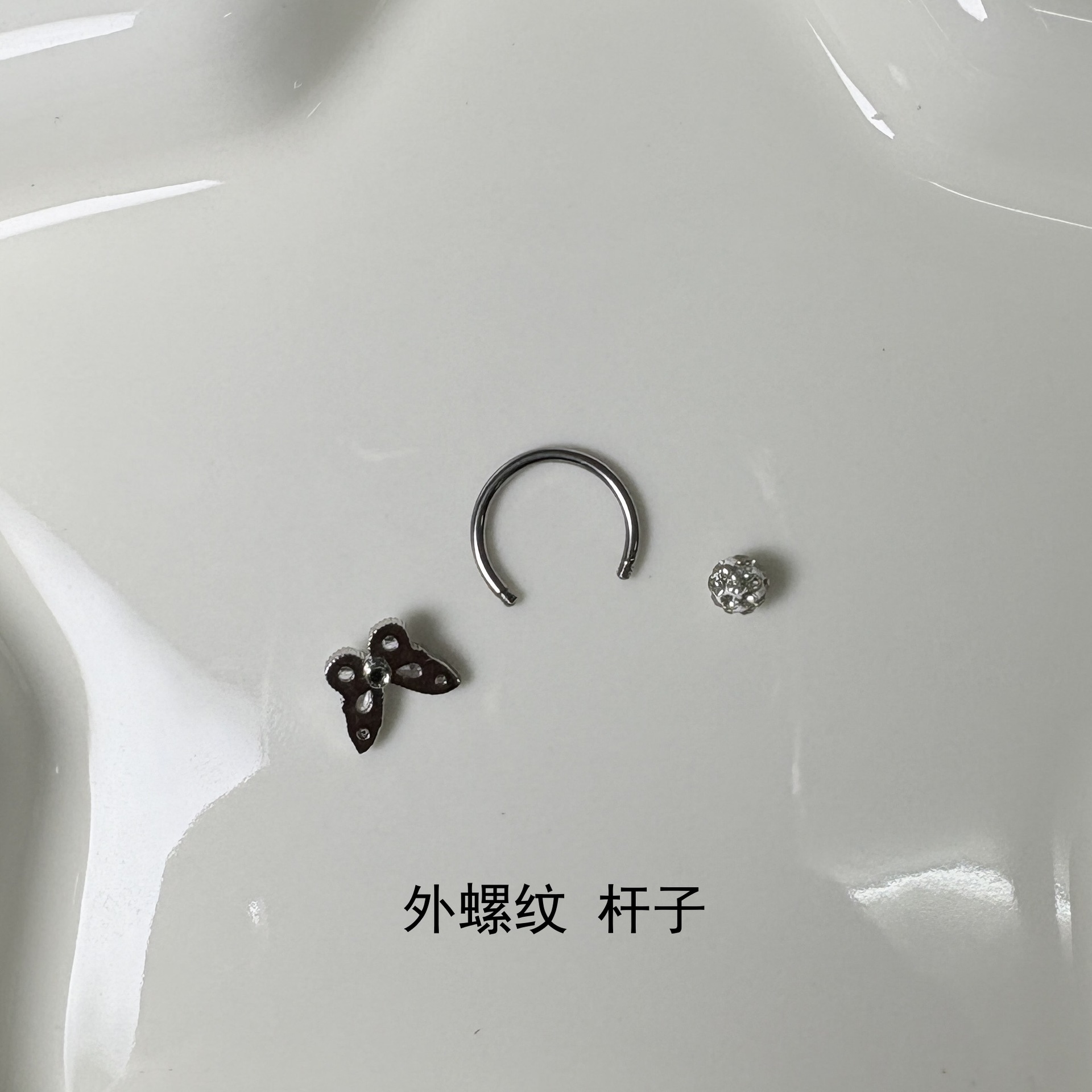 Silver pointed spike labret stud material detail