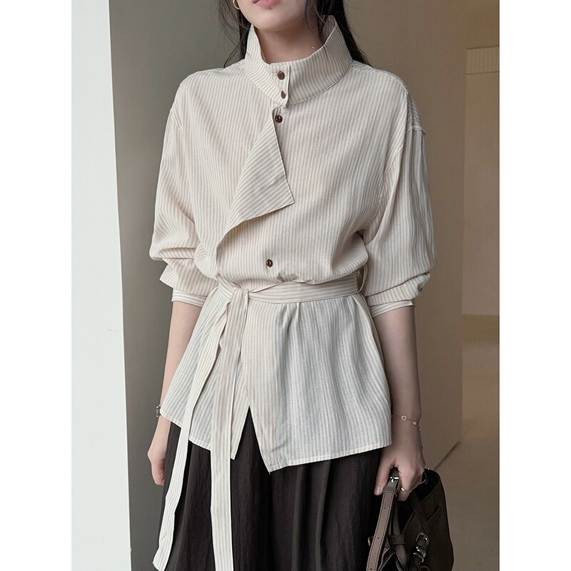 Early autumn beige textured shirt for women, high-neck, diagonal placket, tie-waist, slimming long-sleeve top Early autumn beige textured shirt for women, high-neck, diagonal placket, tie-waist, slimming long-sleeve top