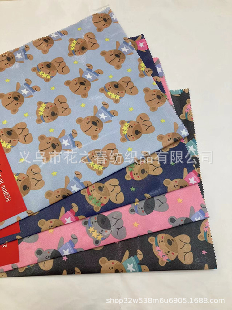 环保600D磨砂革TPU防污防水卡通熊印花面料