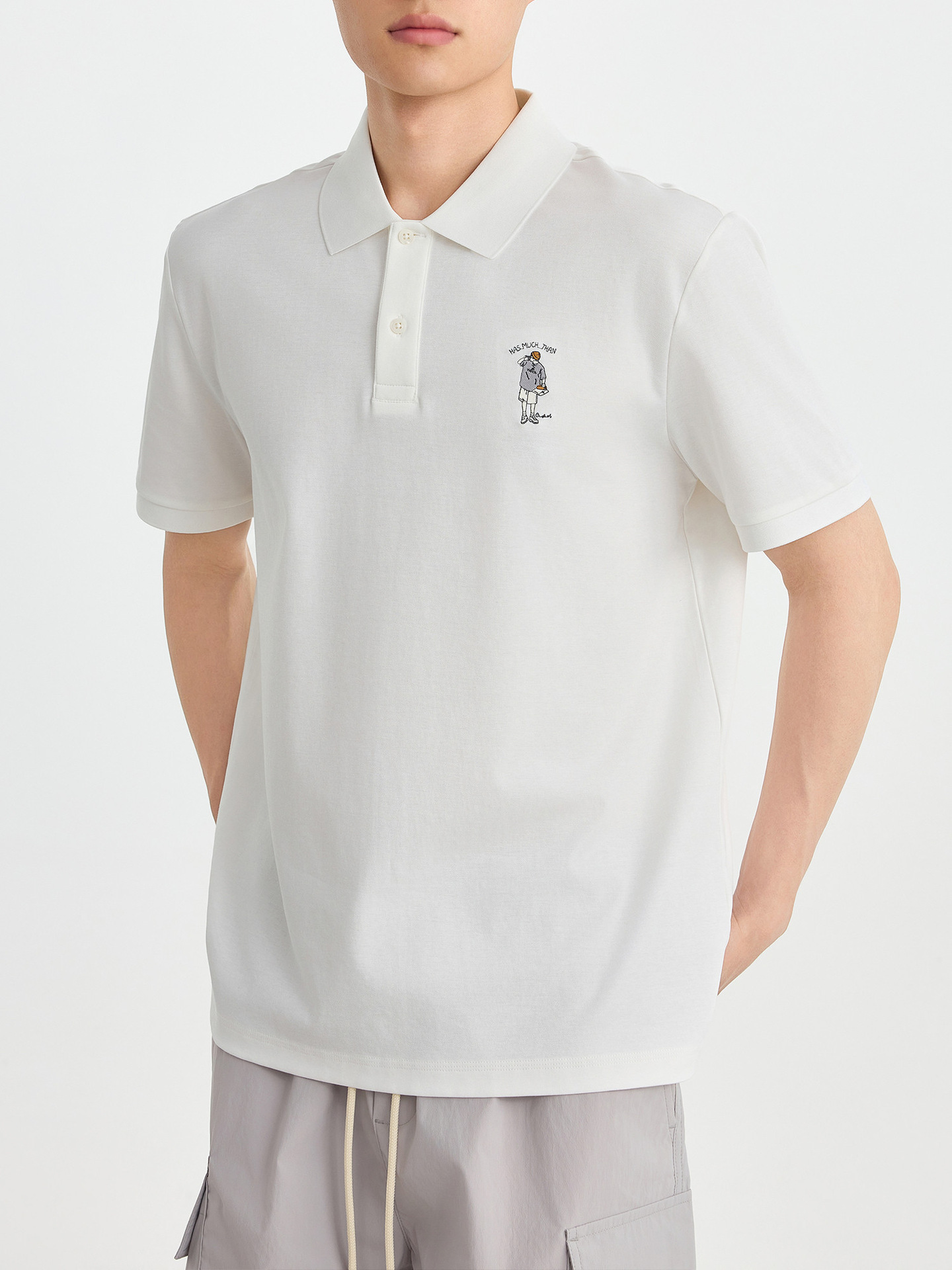Áo polo nam cổ bẻ thêu họa tiết, tay ngắn, chất liệu cotton pha — đen