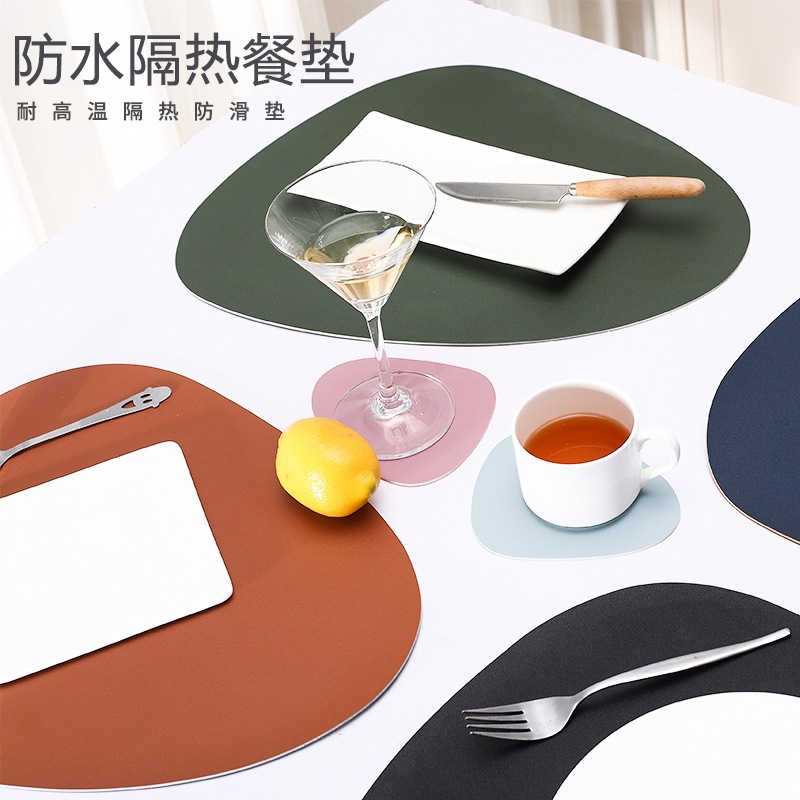 En stock de doble color de doble cara de cuero nórdico mantel impermeable a prueba de aceite de aislamiento térmico antideslizante hogar en forma de gota placemat conjunto