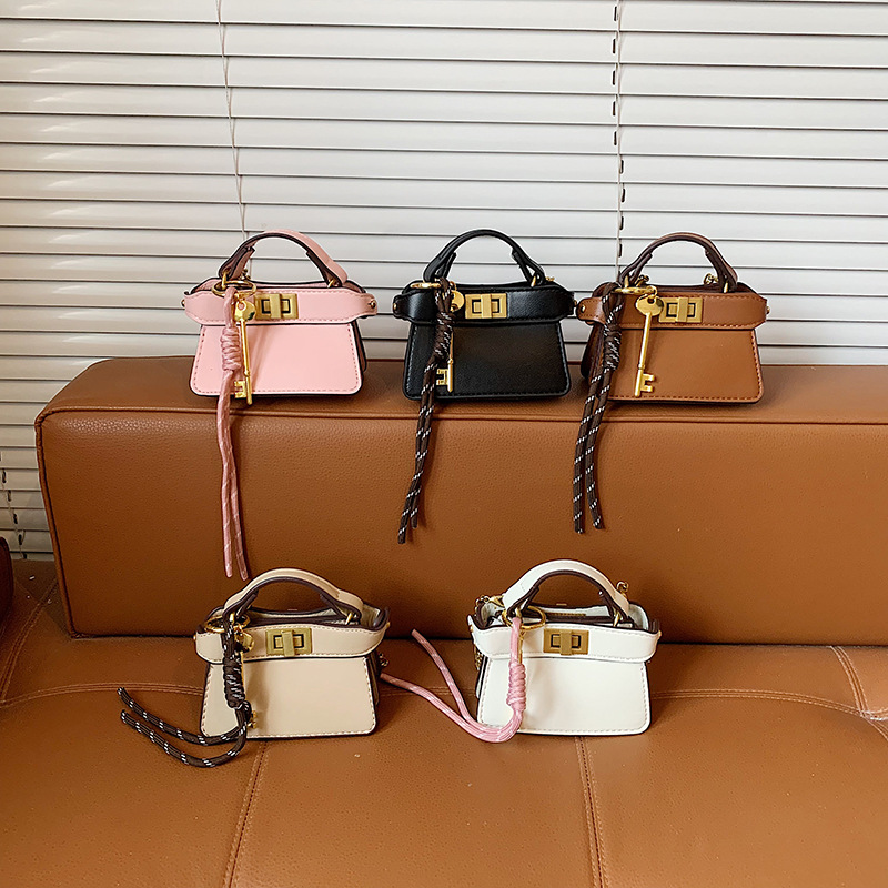 Coreano simple bolso de niña de color sólido mini bolso de bebé 2026 bolso para niños de comercio exterior transfronterizo