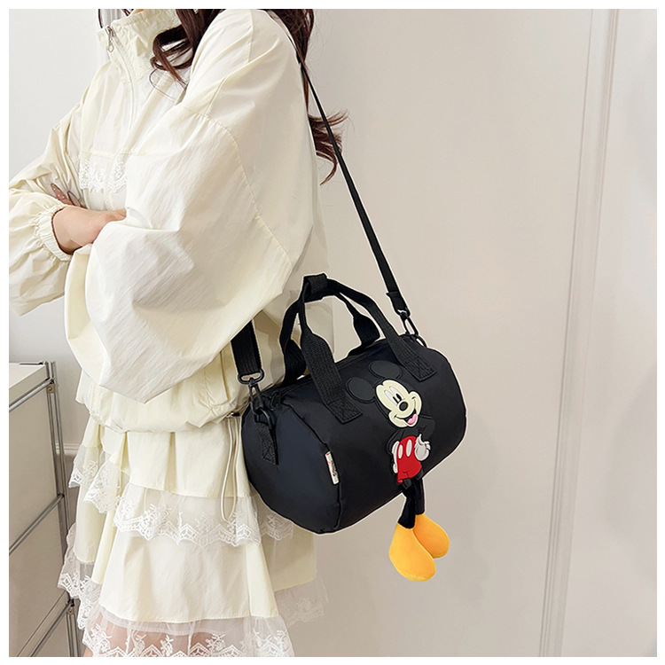 The 2021 new children's bags feature a cute Mickey Mouse pattern bowling bag for girls and a fashionable hand-held shoulder bag undefined