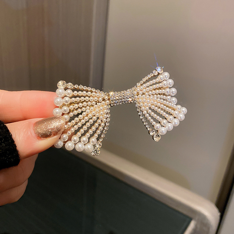 Fashion Korean Electroplating Pearl Bow Hairpin Personality Simple Alloy Hair Clip display picture 5