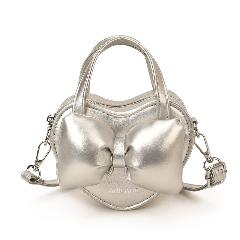 Mini lindos bolsos de mano en forma de corazón de melocotón, bolsos de hombro para bebés de color sólido, nuevos bolsos para niños transfronterizos